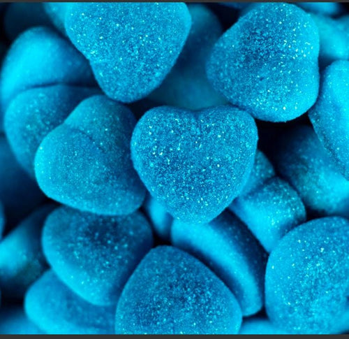 Macro close-up of a sugar-dusted blue heart gummy in sharp focus, surrounded by a soft blue-toned blur.